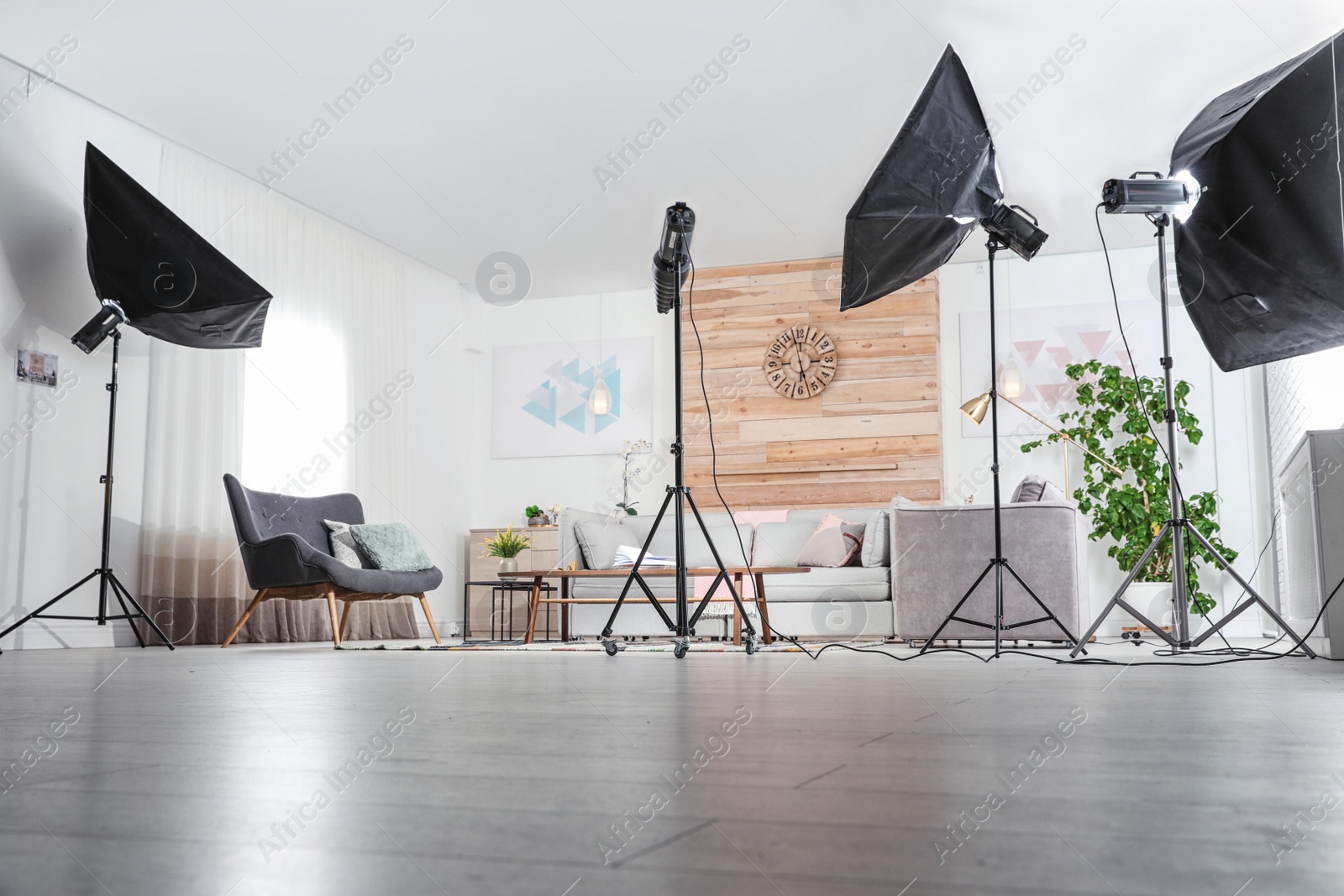 Photo of Professional photo studio equipment prepared for shooting living room interior