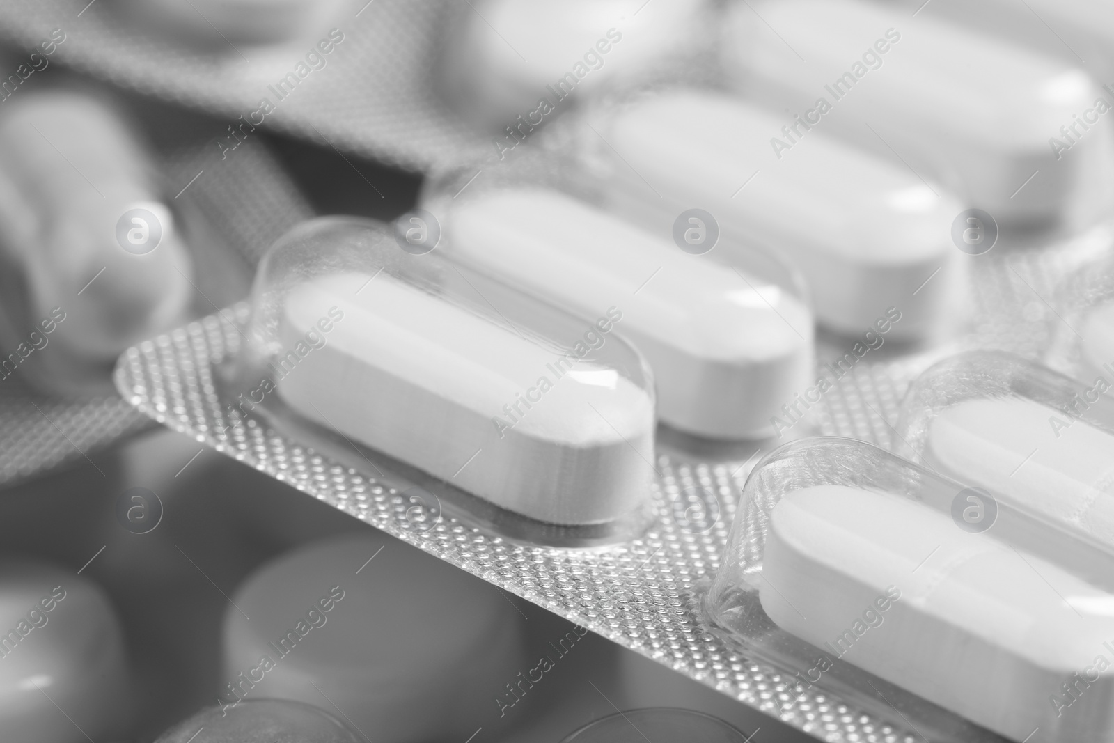 Photo of Many different pills in blisters, closeup view