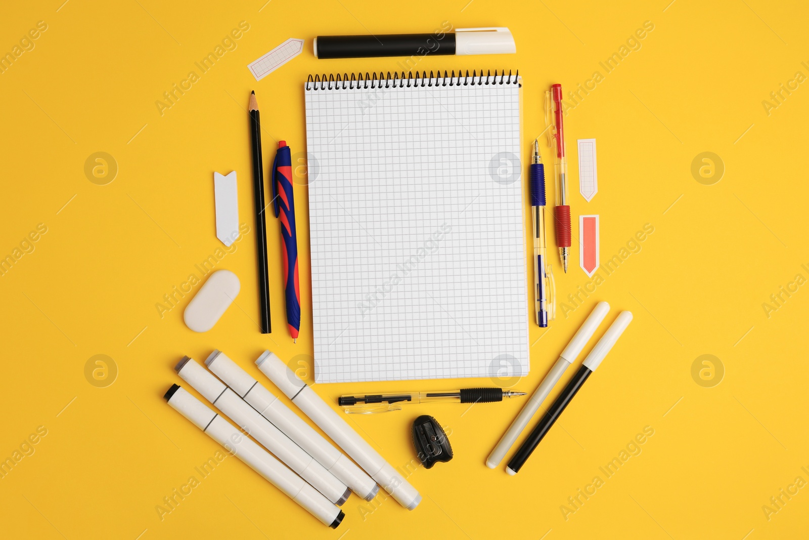 Photo of Different school stationery on yellow background, flat lay with space for text. Back to school