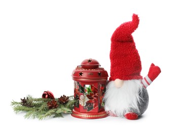 Photo of Funny Christmas gnome and festive decor on white background
