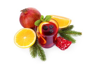 Photo of Aromatic Christmas Sangria drink in glass, fir branches and ingredients isolated on white