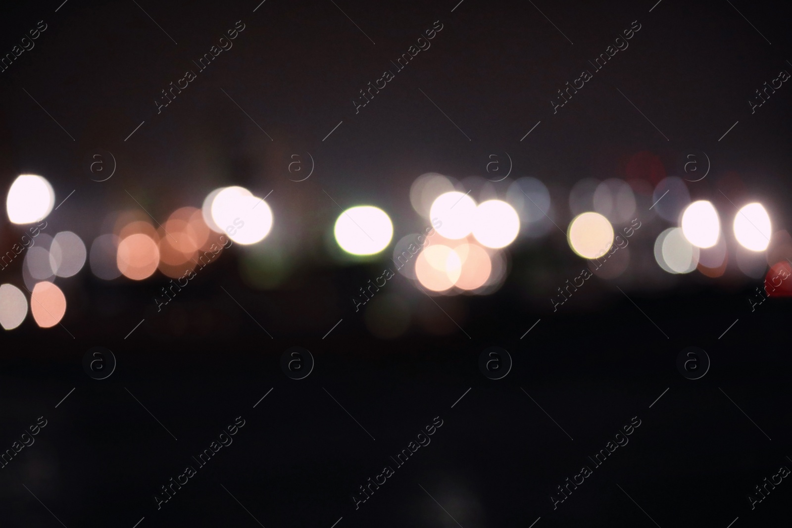 Photo of Blurred view of port at night. Bokeh effect