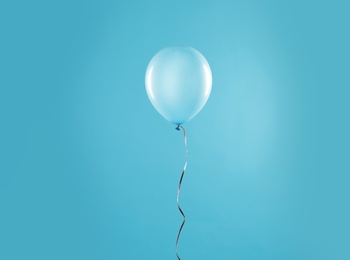 Bright balloon on color background. Celebration time