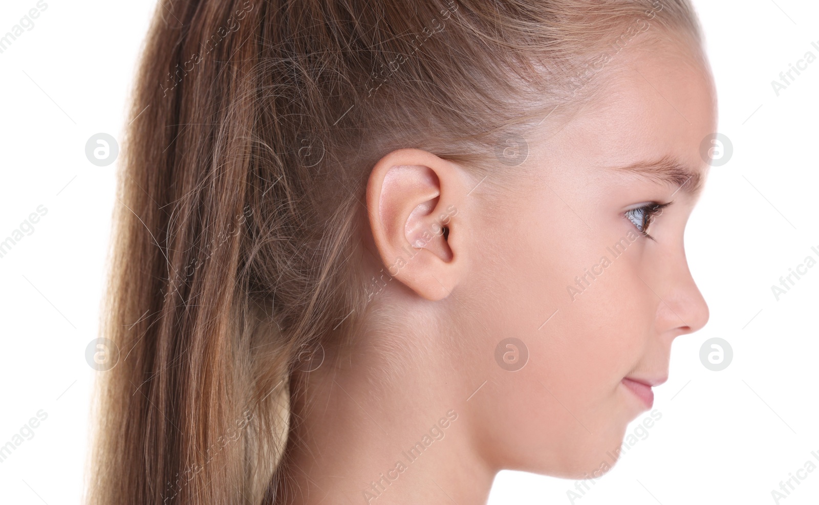 Photo of Cute little girl on white background, closeup. Hearing problem