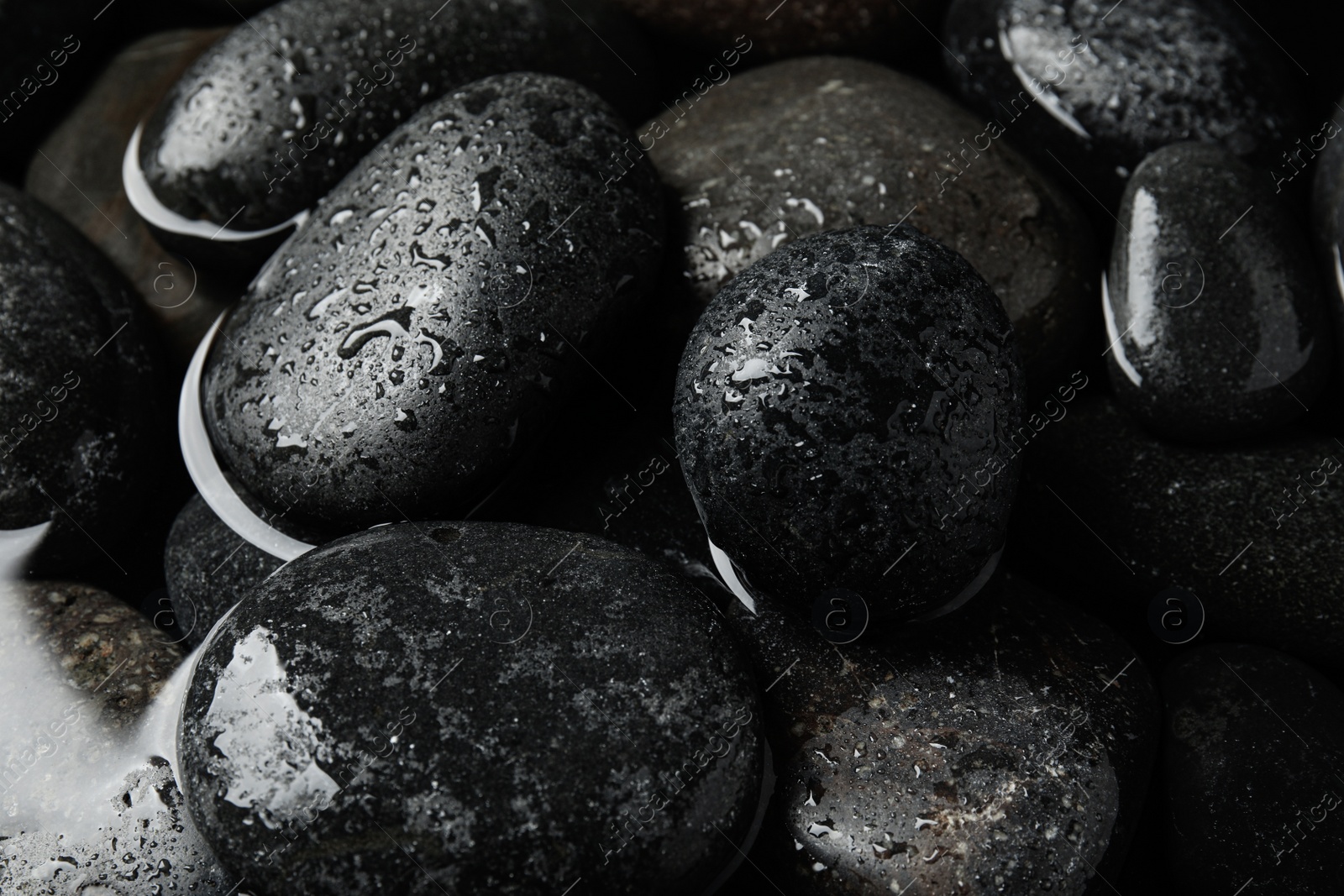 Photo of Pile of stones in water as background, closeup. Zen lifestyle