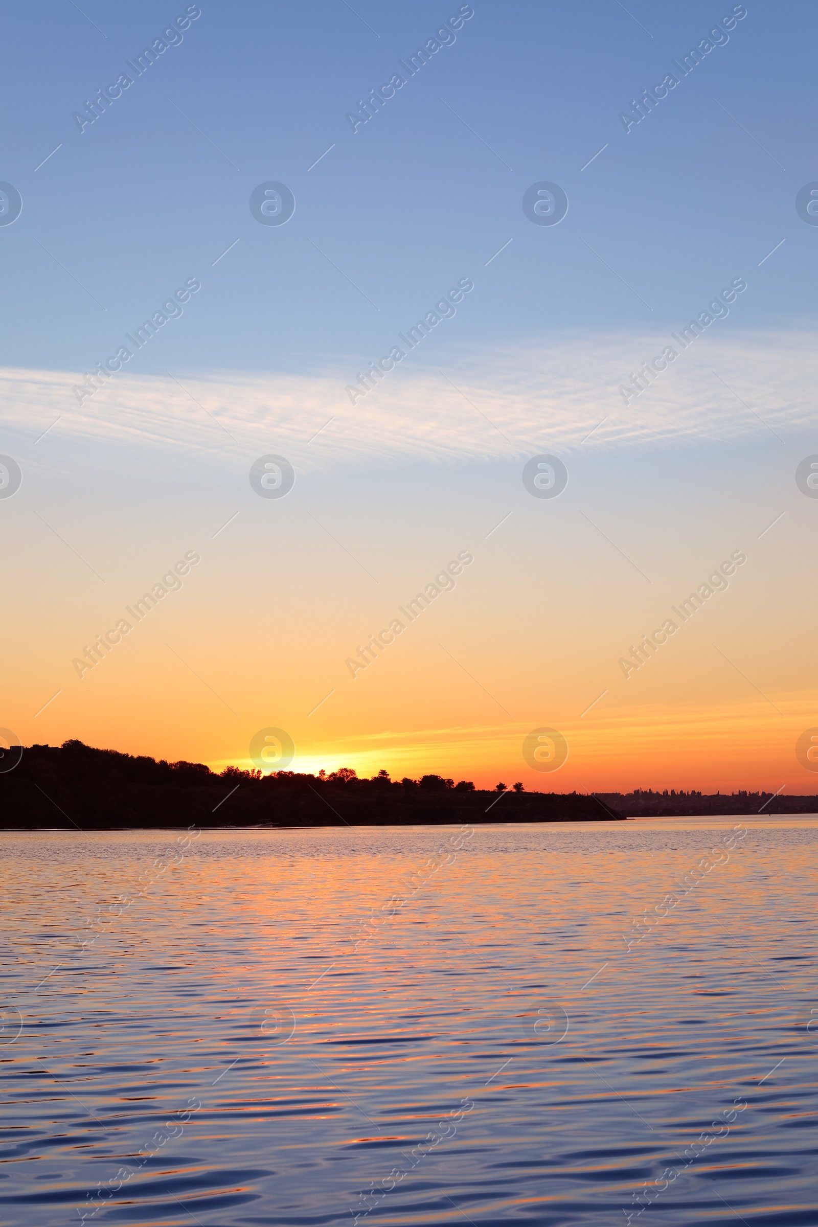 Photo of Picturesque view of beautiful sunset on riverside