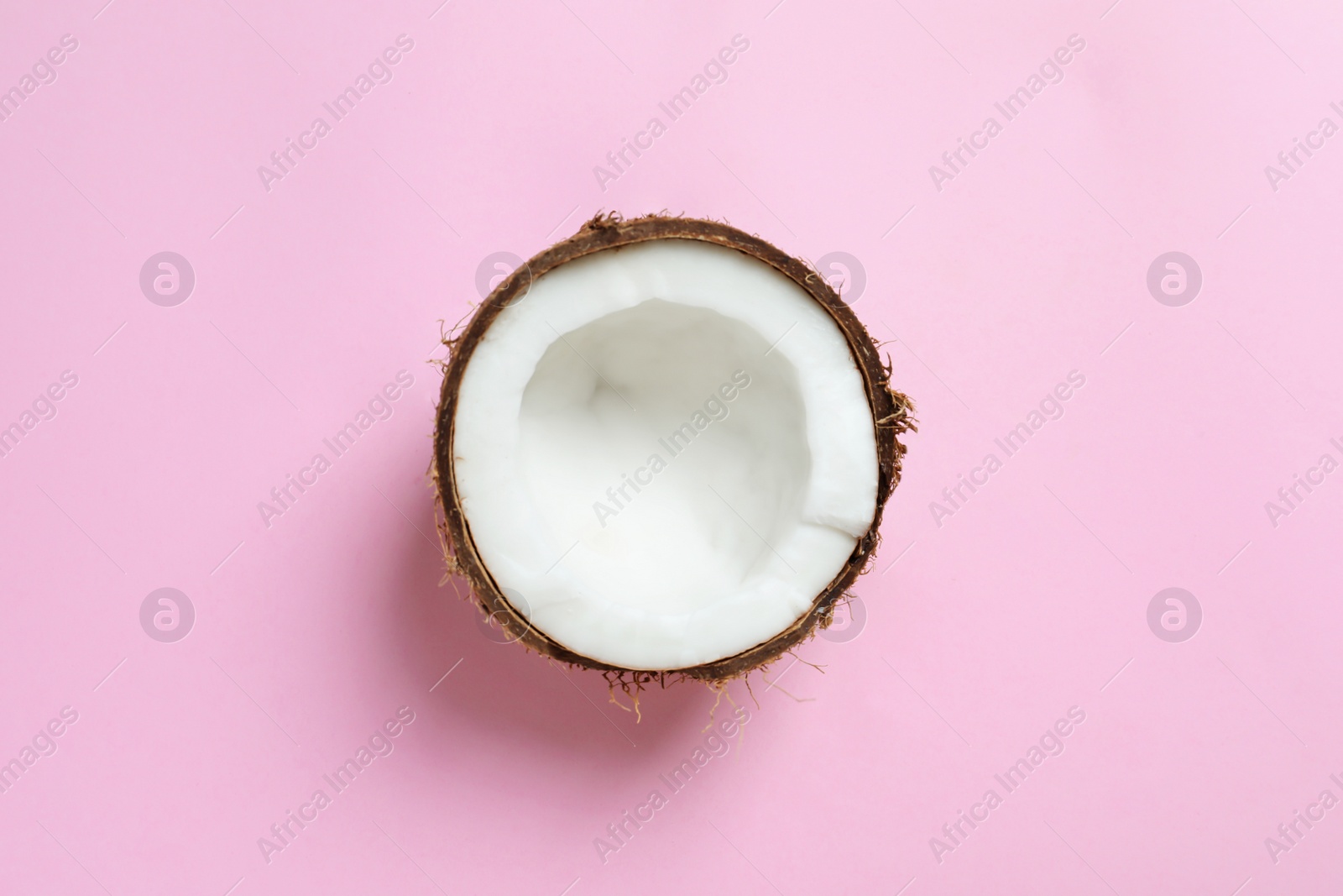 Photo of Coconut half on color background