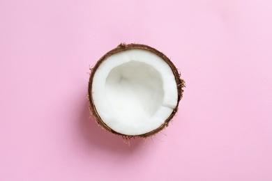 Coconut half on color background