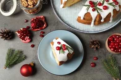 Photo of Flat lay composition with traditional homemade Christmas cake on grey table