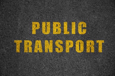 Image of Text PUBLIC TRANSPORT written on asphalt road, top view