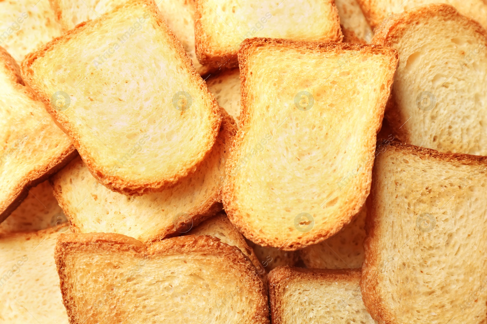 Photo of Toasted slices of bread as background, closeup