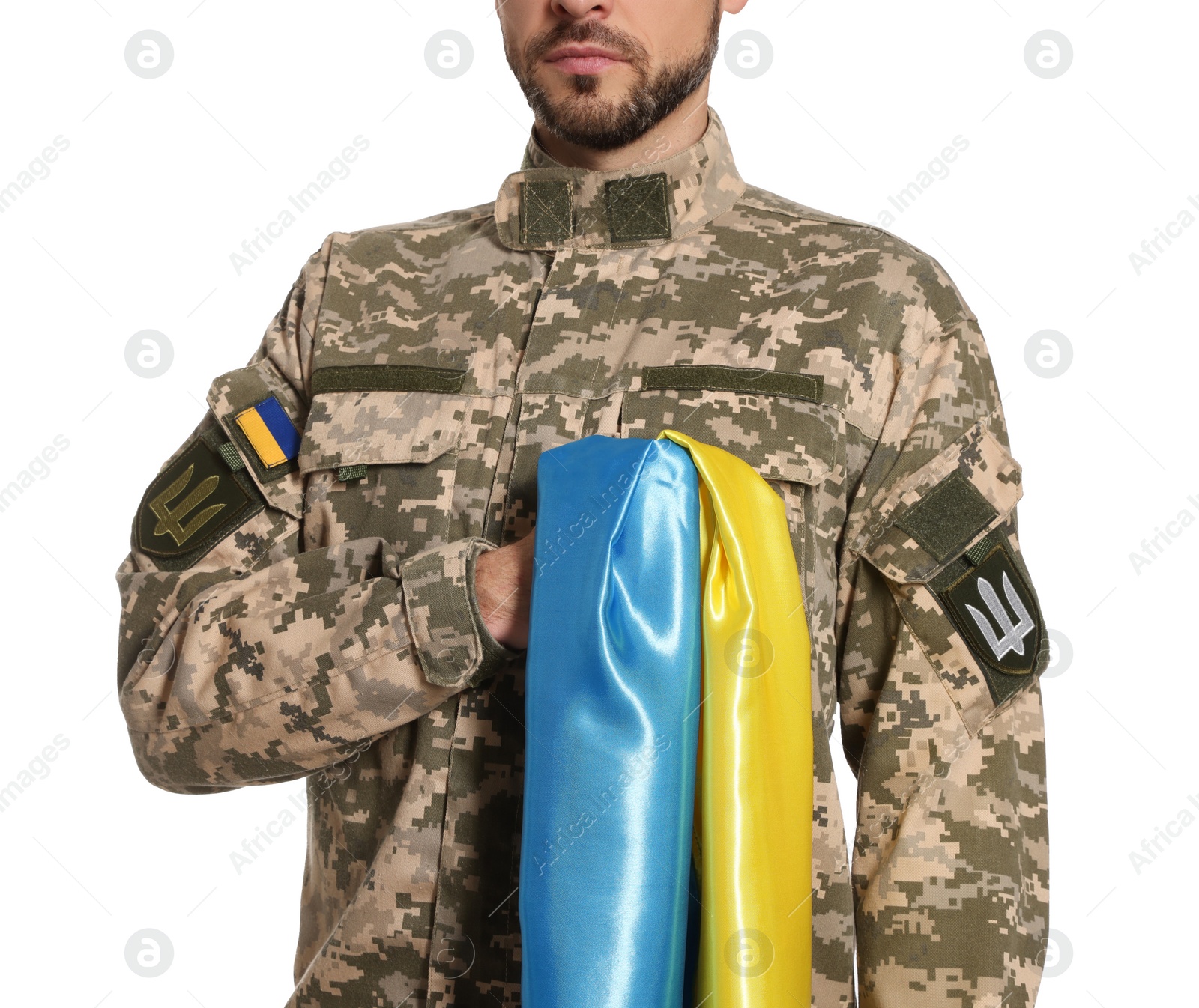 Photo of Soldier in military uniform with Ukrainian flag on white background, closeup