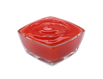 Photo of Glass bowl of tasty ketchup isolated on white. Tomato sauce
