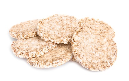 Photo of Many crunchy buckwheat cakes on white background