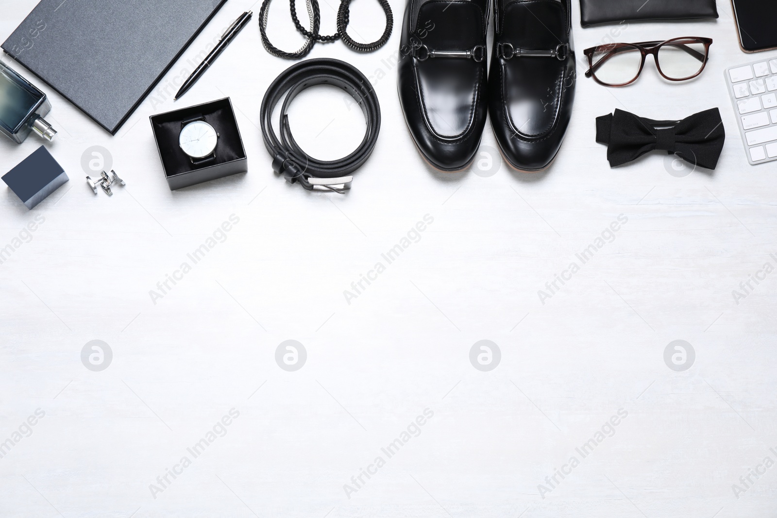 Photo of Gentleman accessories on white background, flat lay. Space for text