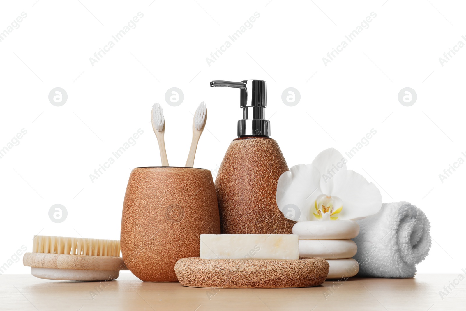 Photo of Bath accessories. Different personal care products and flower on wooden table against white background