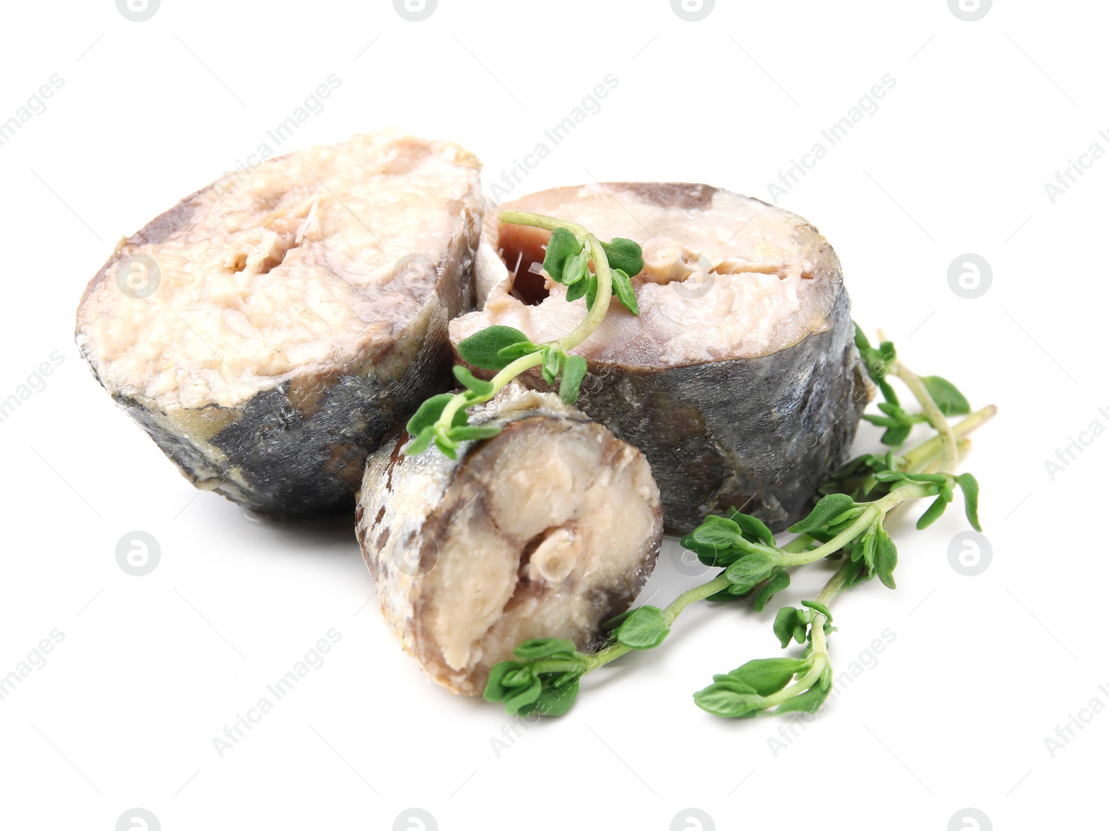 Photo of Canned mackerel chunks with thyme on white background