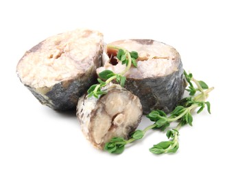 Photo of Canned mackerel chunks with thyme on white background