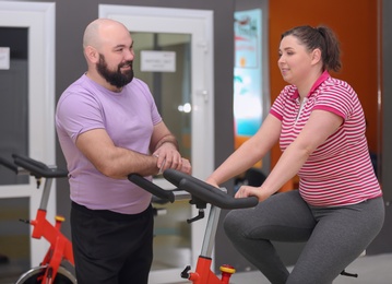 Photo of Overweight couple together in gym