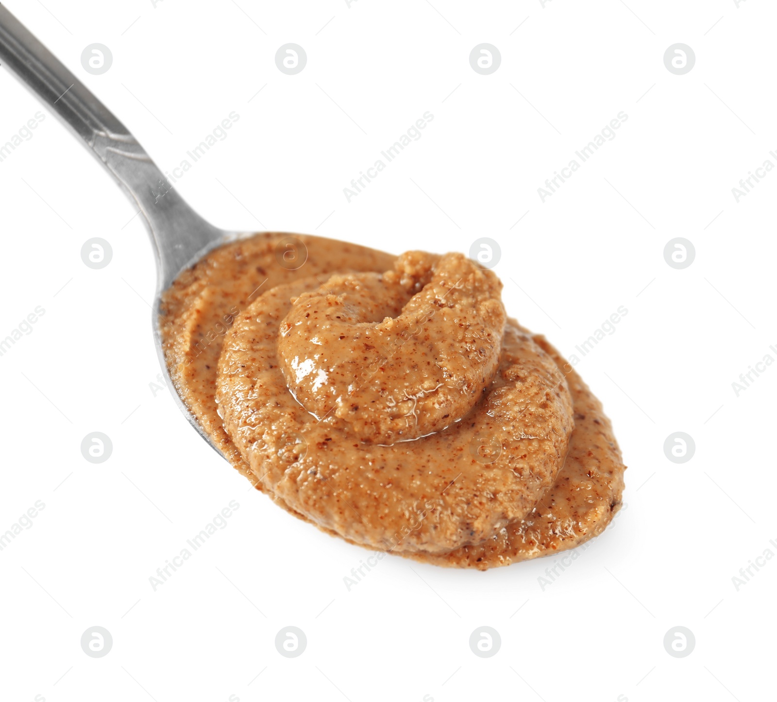 Photo of Delicious nut butter in spoon isolated on white