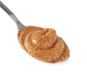 Photo of Delicious nut butter in spoon isolated on white