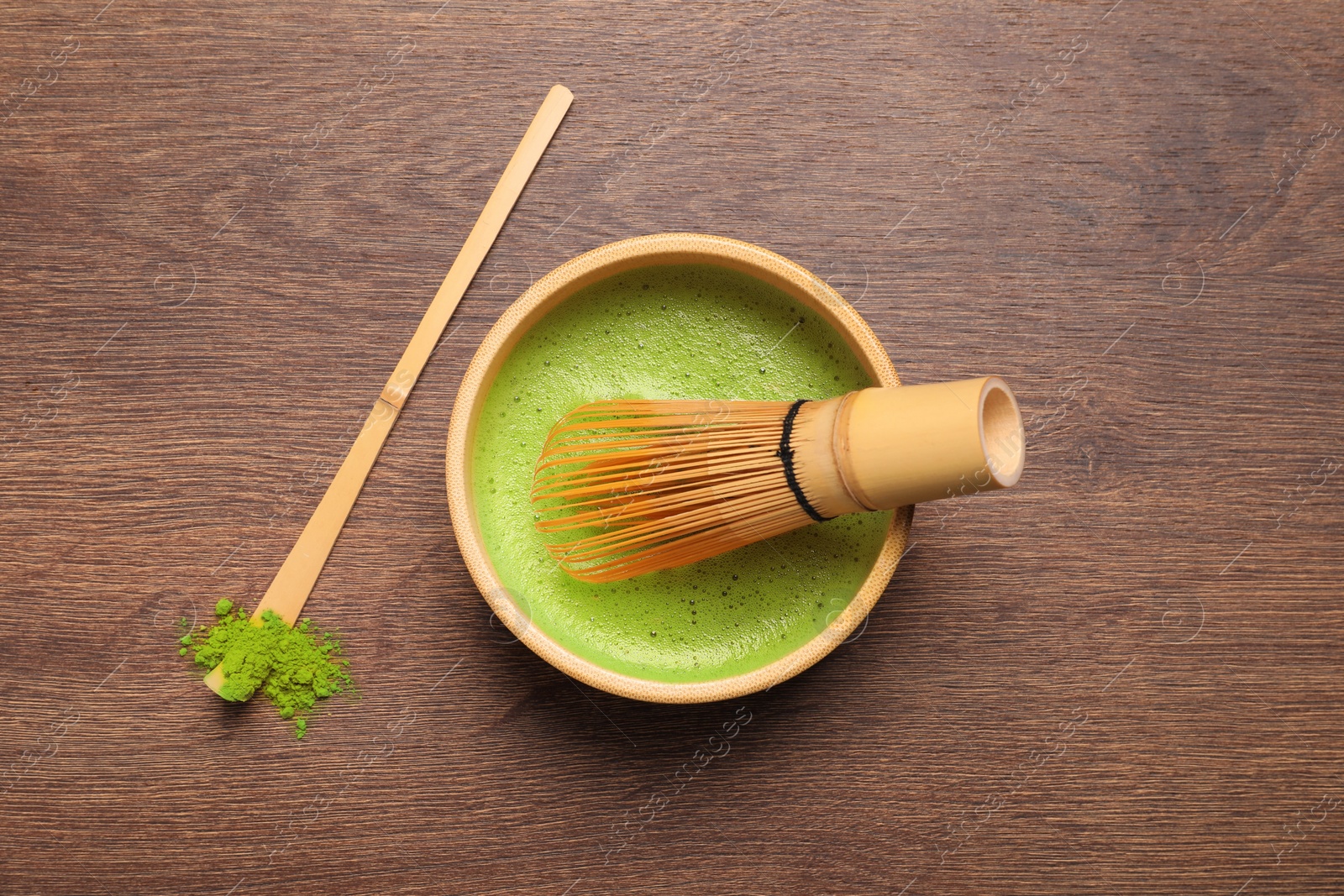 Photo of Flat lay composition with matcha tea on wooden table