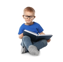 Photo of Little child with eyeglasses and book on white background