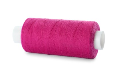 Spool of pink sewing thread isolated on white