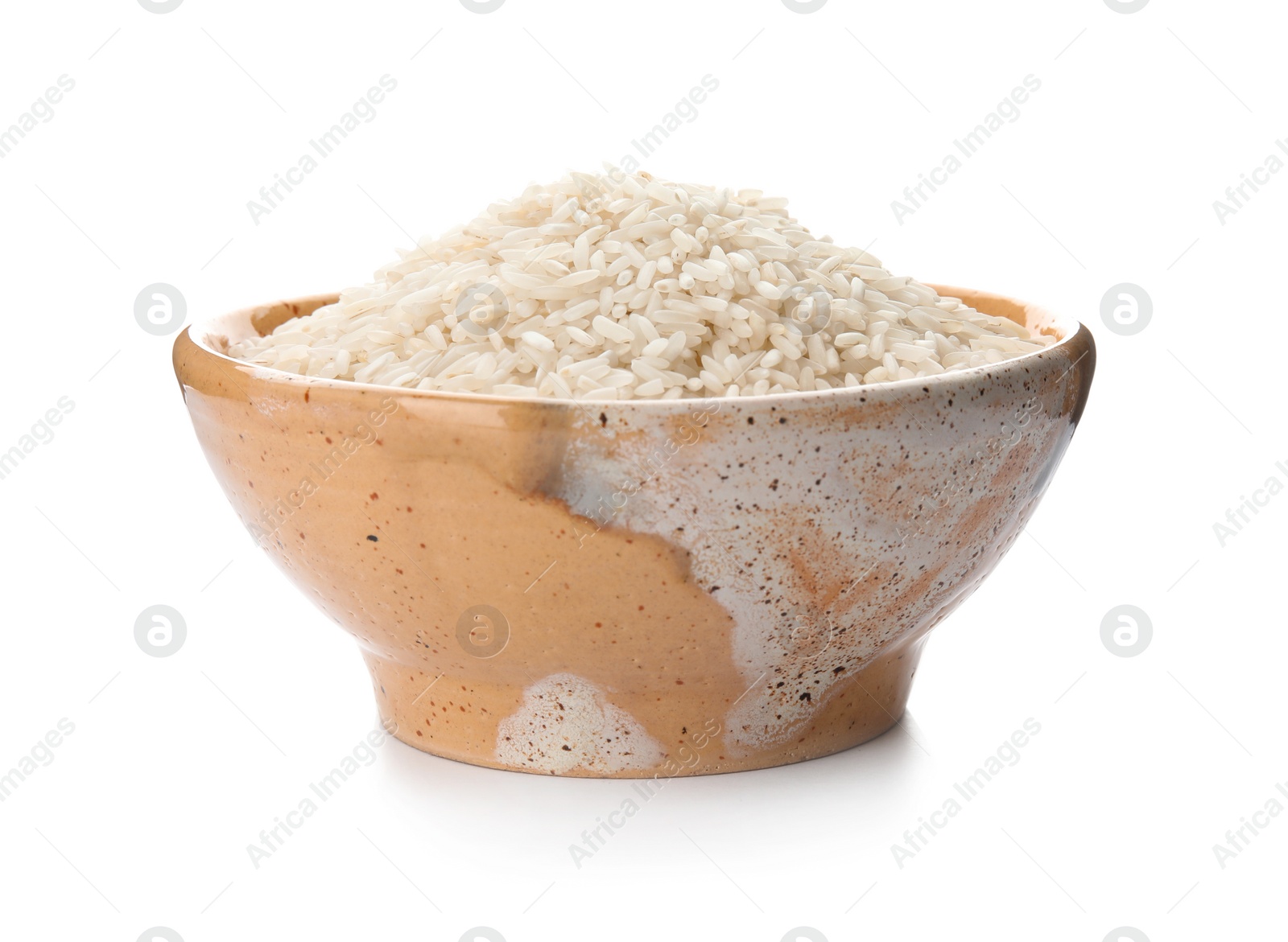 Photo of Bowl with uncooked rice on white background