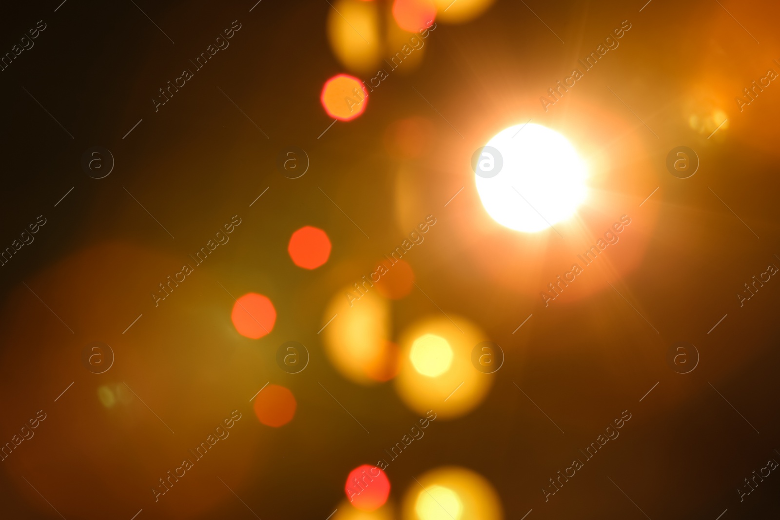 Photo of Blurred view of beautiful lights on dark background. Bokeh effect