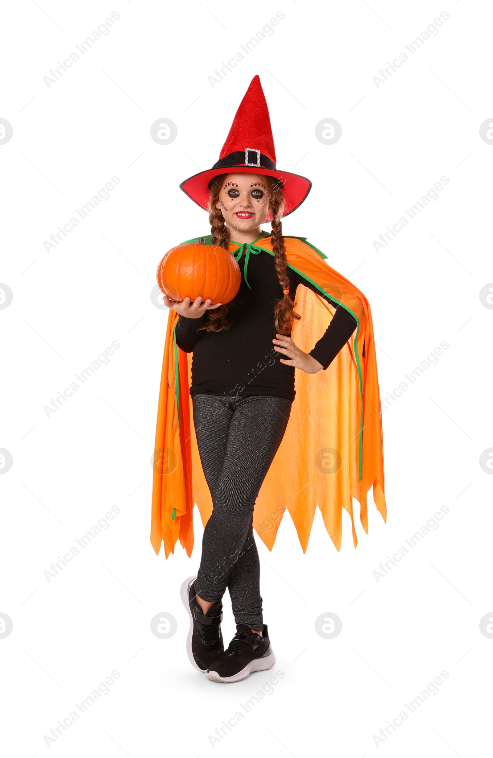 Photo of Cute little girl with pumpkin wearing Halloween costume on white background