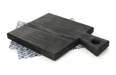 Photo of Black wooden cutting board and napkin isolated on white