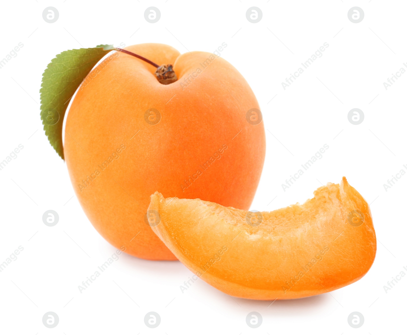 Photo of Delicious ripe apricot with slice isolated on white