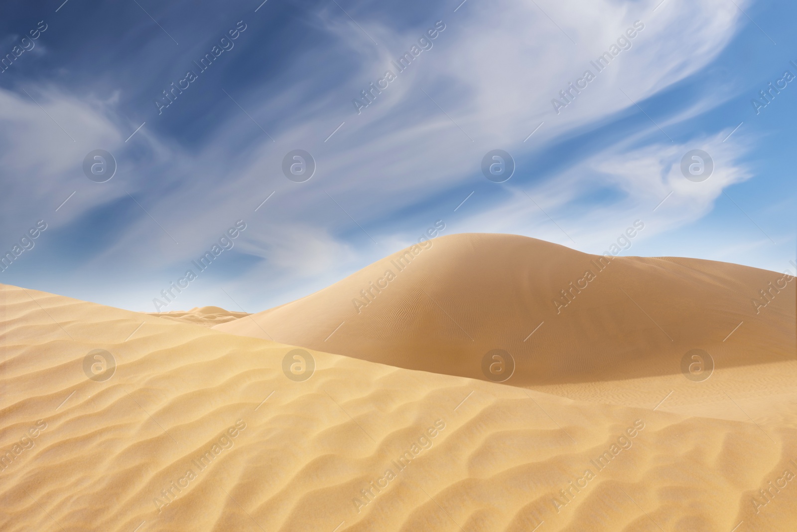 Image of Picturesque view of sandy desert and blue sky on hot sunny day 