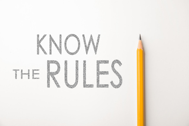 Image of Phrase Know the rules and pencil on white background, top view