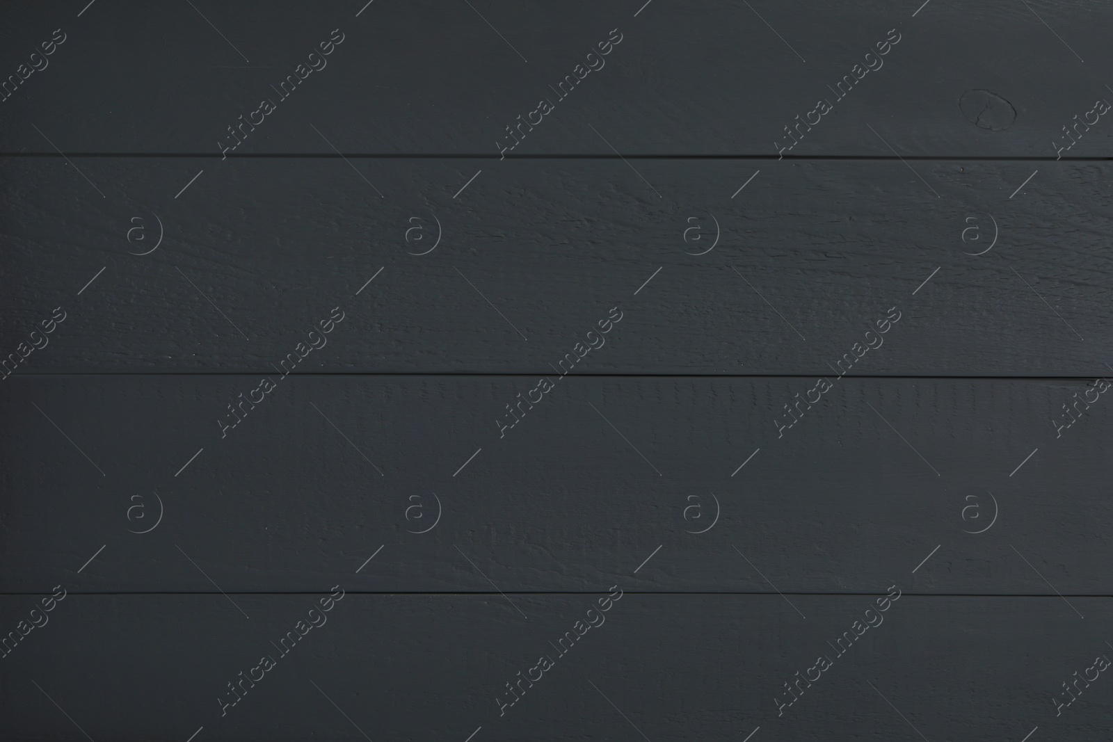Photo of Texture of black wooden surface as background, closeup