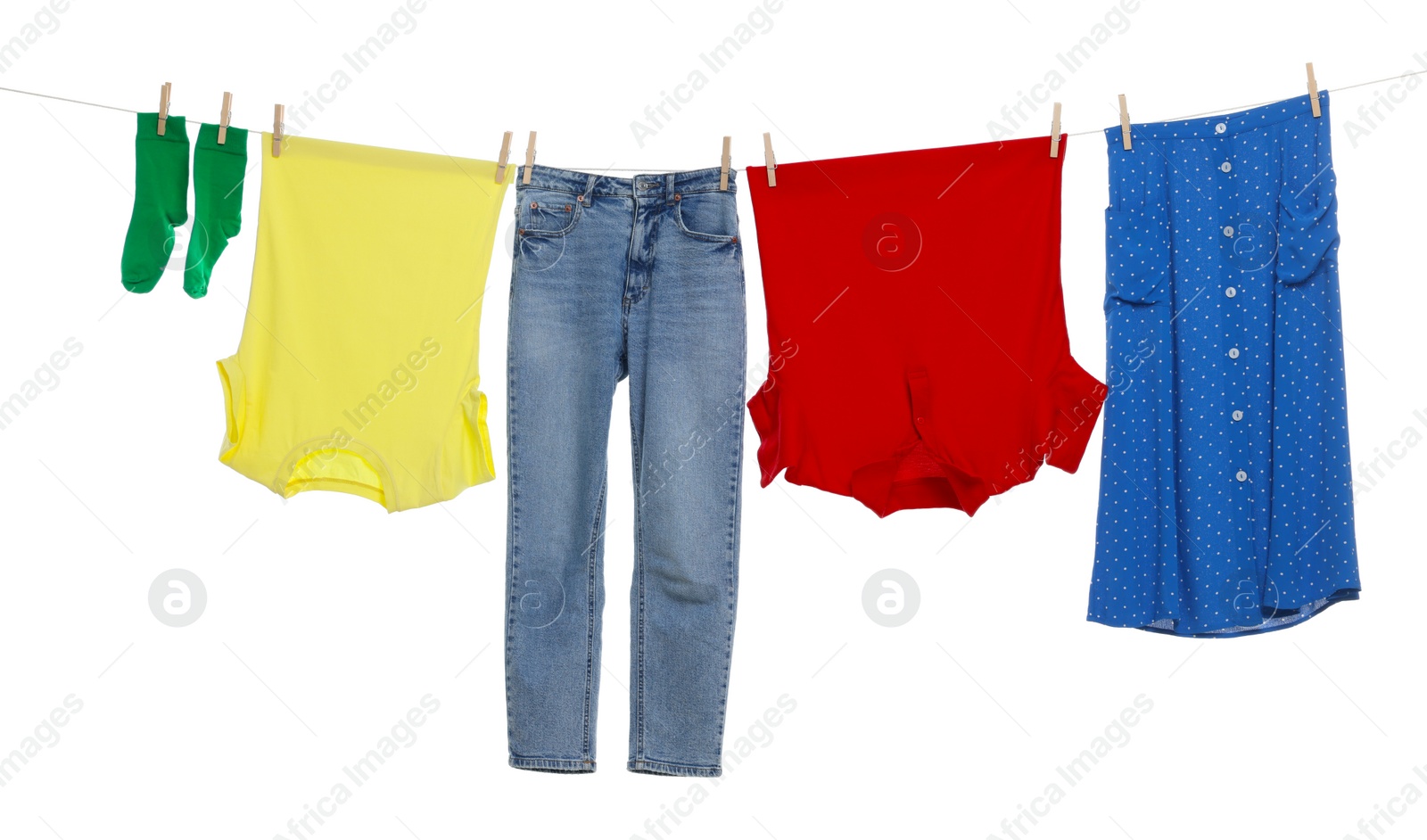 Photo of Different clothes drying on laundry line against white background