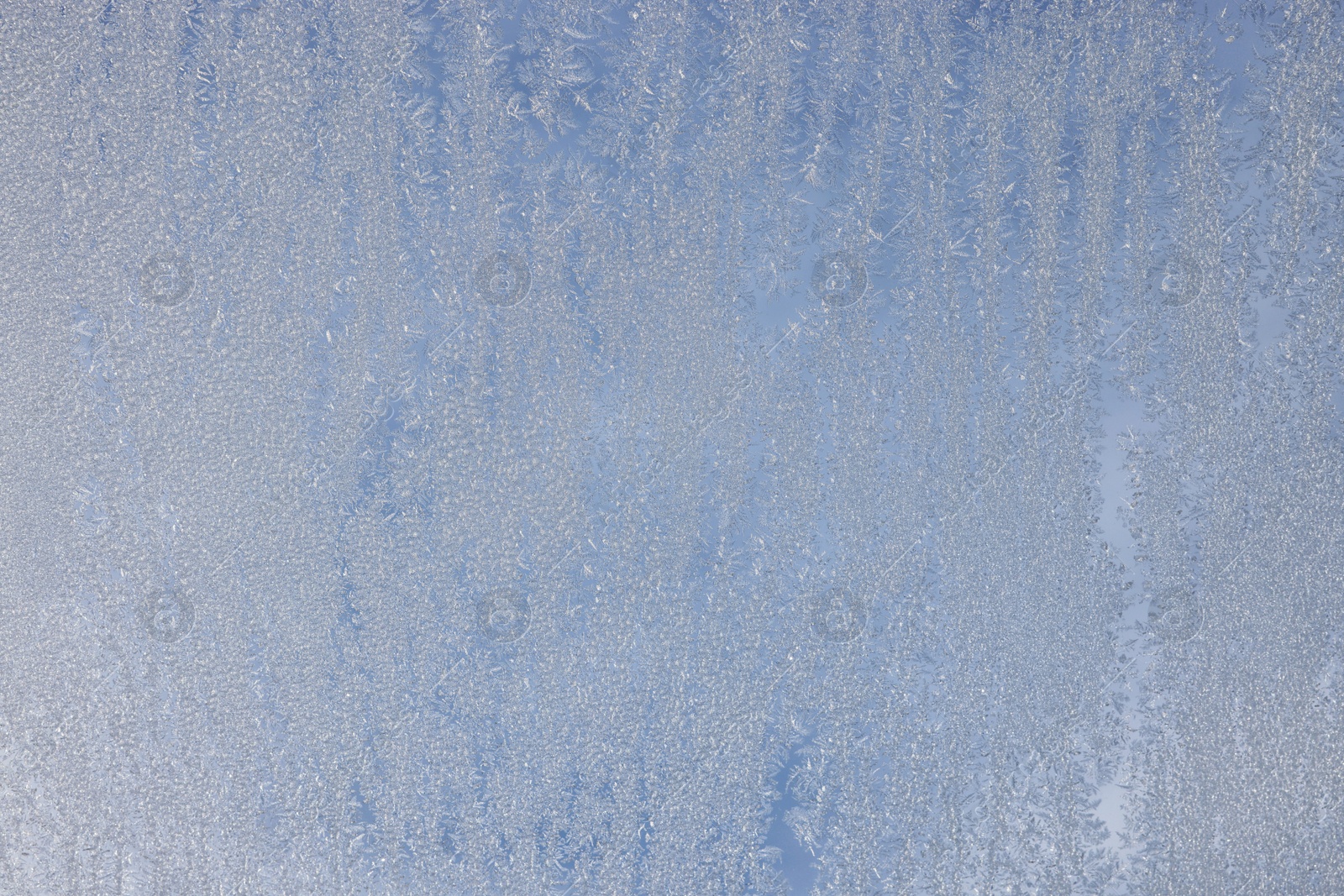 Photo of Beautiful frosty window as background, closeup. Winter morning