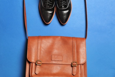 Flat lay composition with lady's shoes and bag on color background