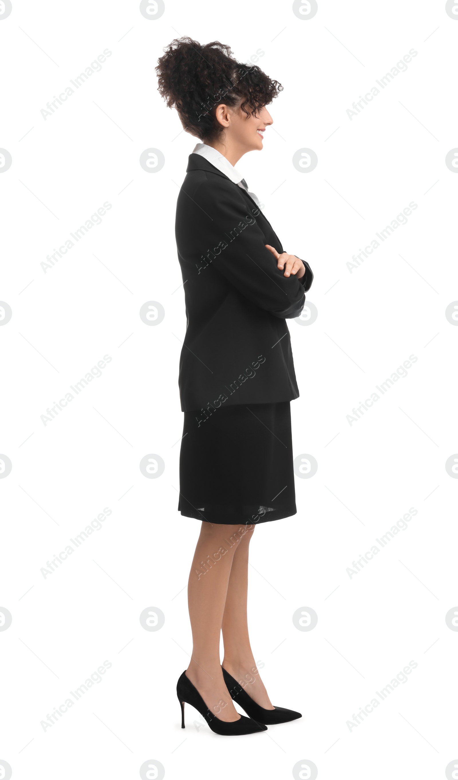 Photo of Young businesswoman in suit standing on white background