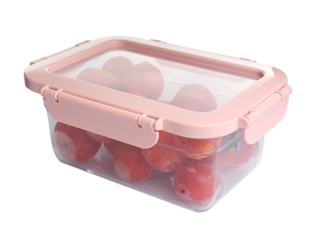 Photo of Frozen tomatoes in plastic container isolated on white. Vegetable preservation