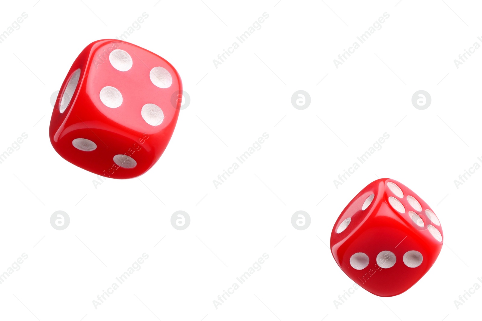 Image of Two red dice in air on white background