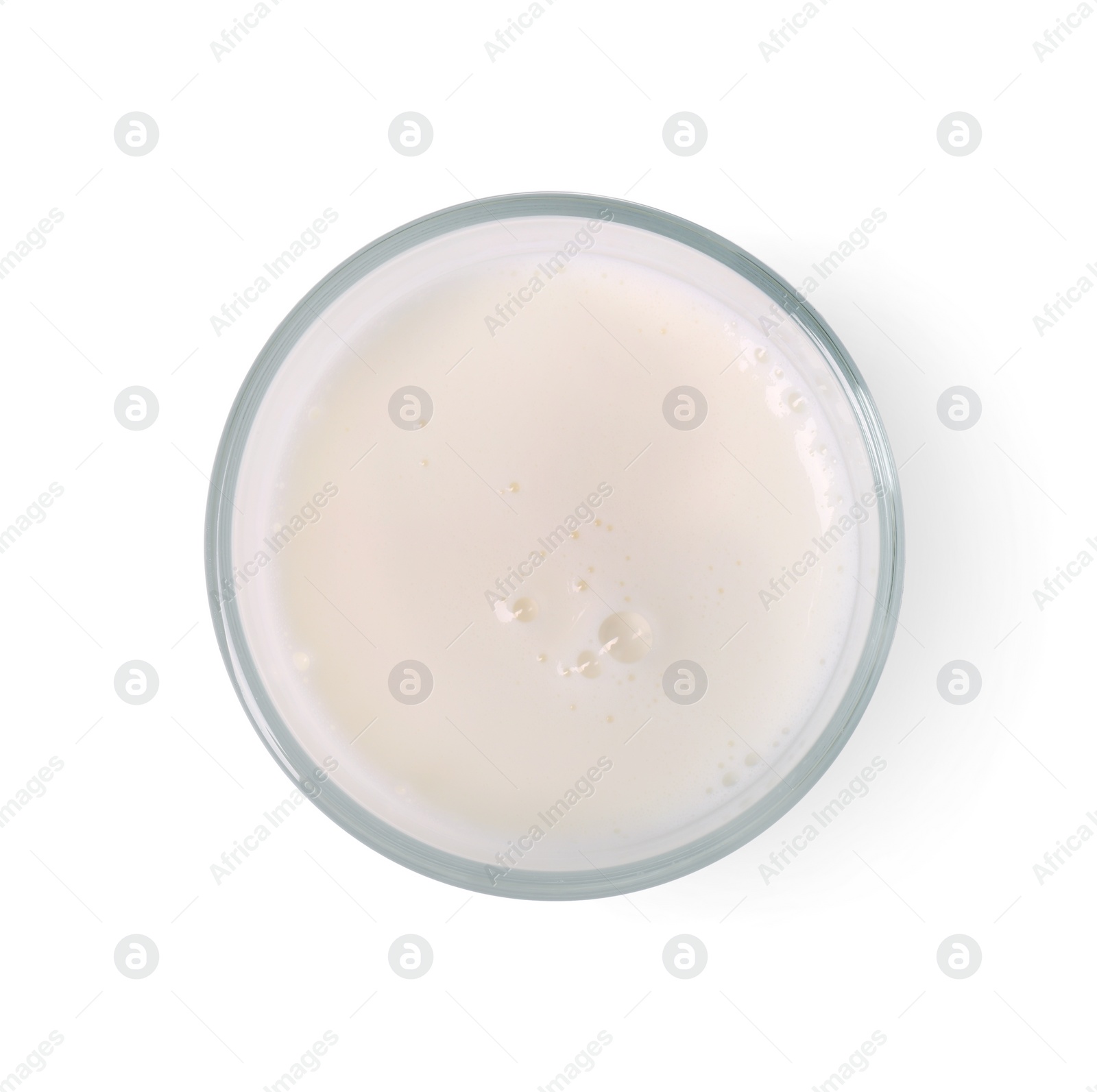 Photo of Glass of fresh milk isolated on white, top view