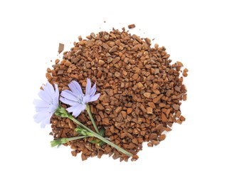 Photo of Pile of chicory granules and flowers on white background, top view