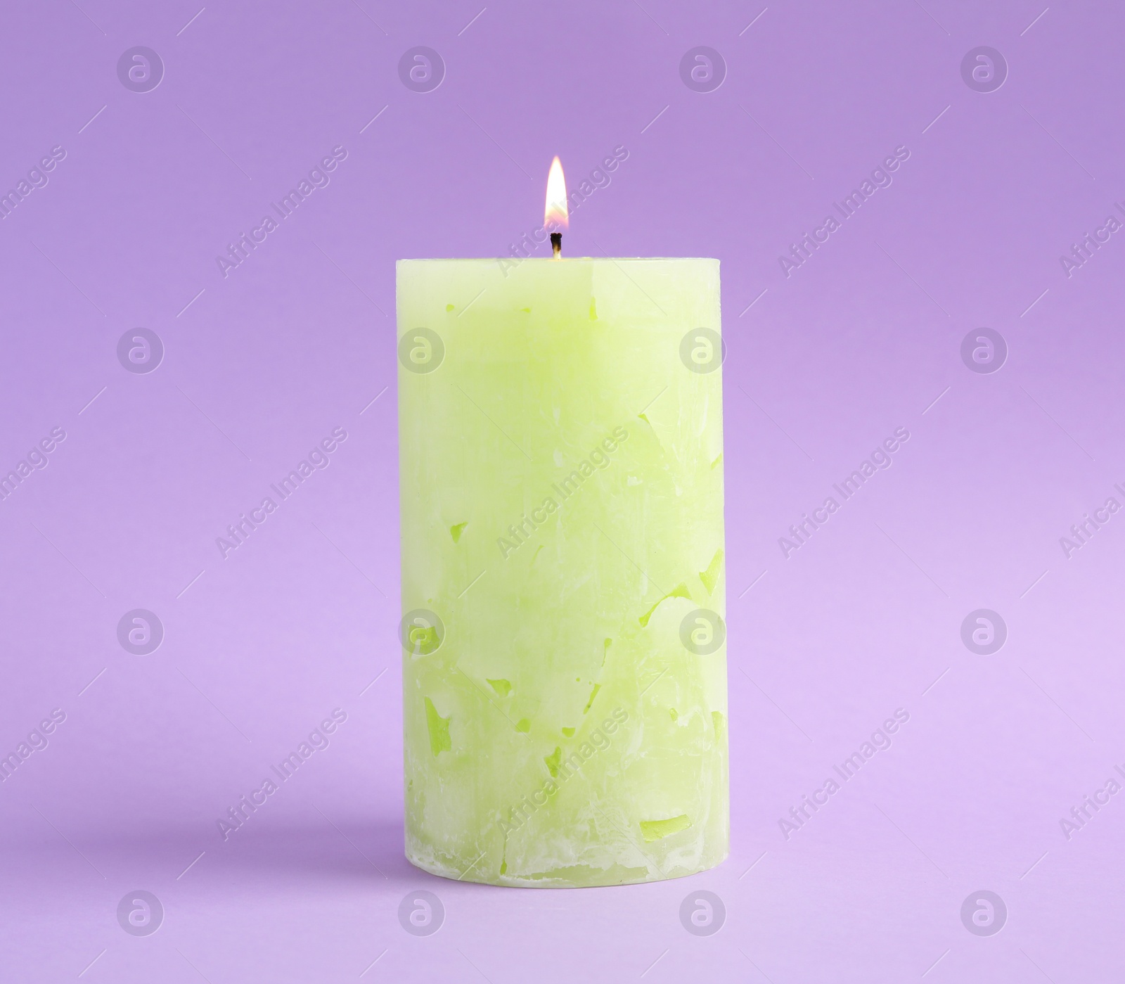 Photo of Alight scented wax candle on color background