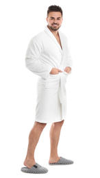 Photo of Handsome man wearing bathrobe on white background