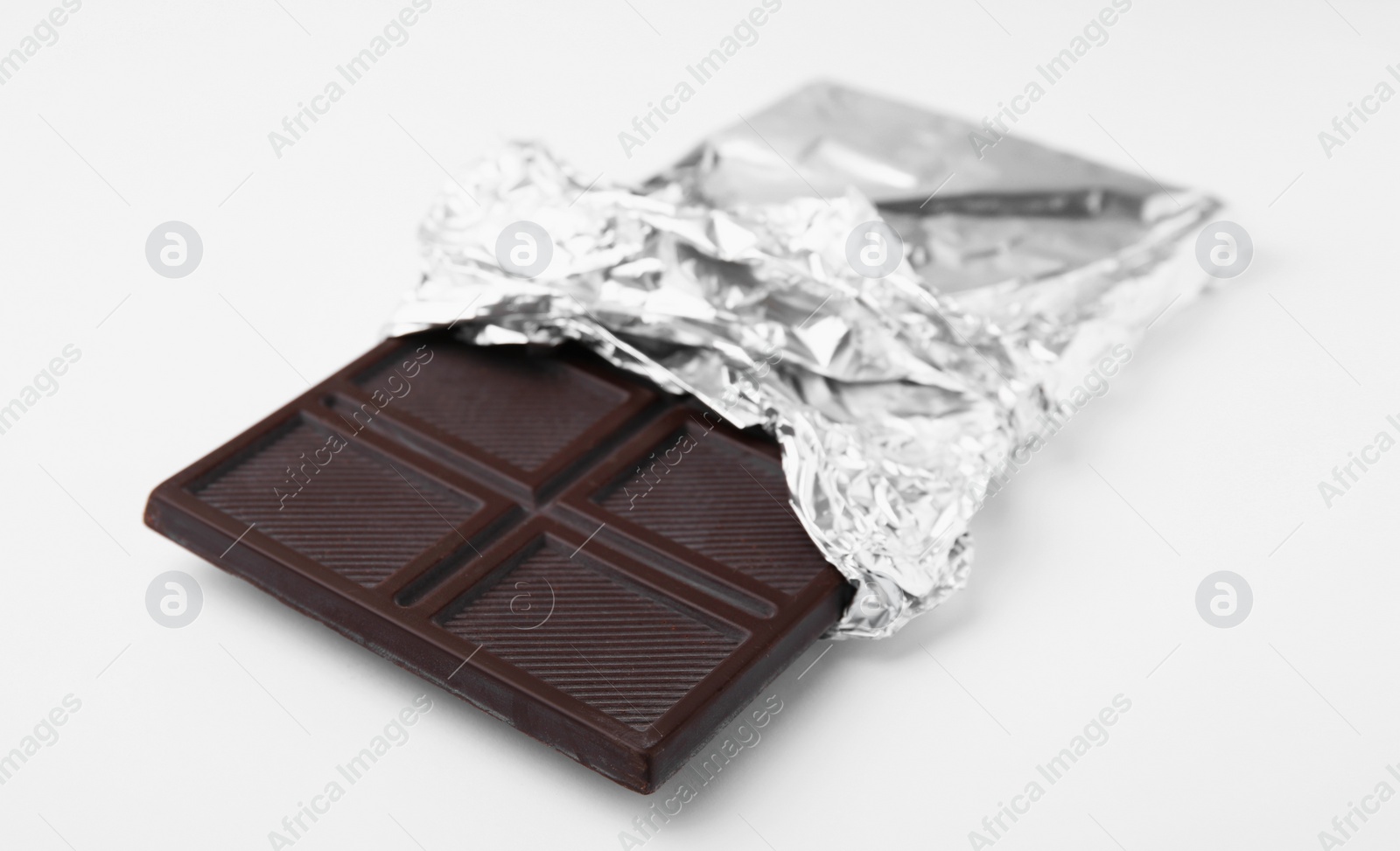 Photo of One tasty chocolate bar on white background
