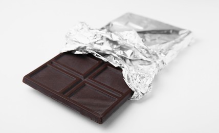 One tasty chocolate bar on white background