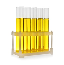 Photo of Test tubes with yellow liquid on white background