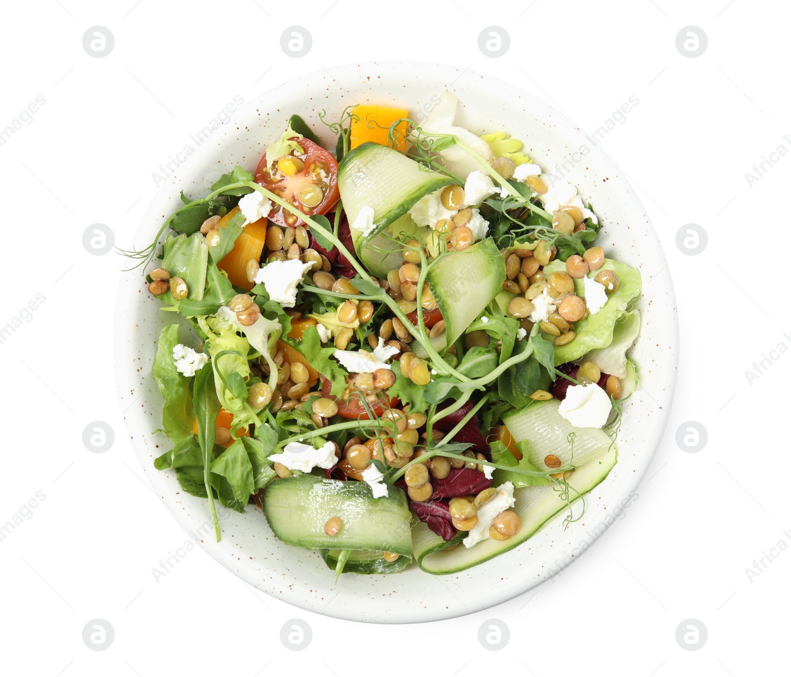 Photo of Bowl of delicious salad with lentils, vegetables and feta cheese isolated on white, top view